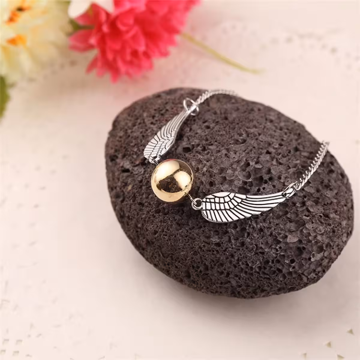 Guldsmykke med Harry Potter-tema