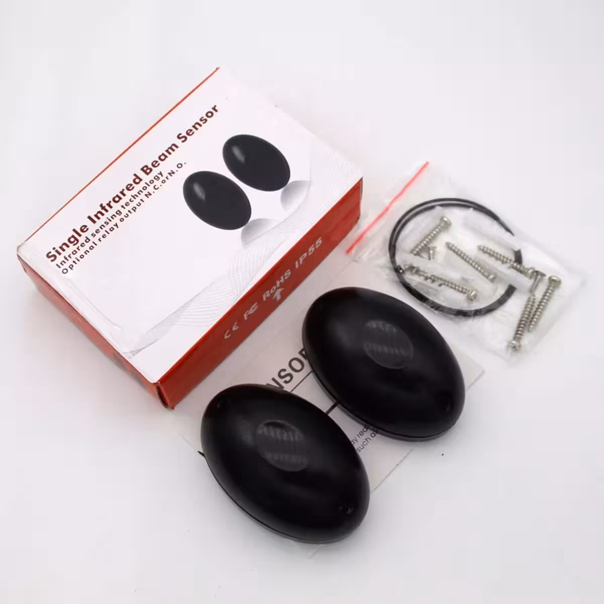 Detaljer om indholdet af pakken med IR-fotoceller til portautomatisering